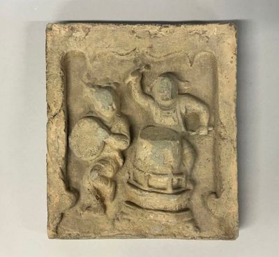 une image représentant un relief en pierre représentant un homme et une femme