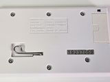 an image of a white electronic device on a white surface