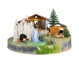 une figurine représentant une crèche avec une mangeoire et une femme