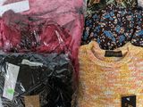 many different types of shirts in a plastic bag