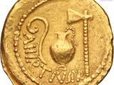 an image of a gold coin with a bird and a vase on it