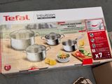 a box with a set of pots and pans on it