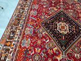 an image of a large oriental rug on a blue floor
