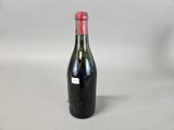 a bottle of wine that is sitting on a table