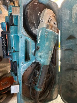 a blue machine that is sitting next to a blue container