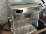 a machine that is sitting on a counter in a kitchen