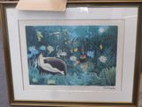 tableau encadré représentant un oiseau dans une forêt tropicale