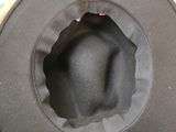 a black hat with a hole in the middle of it