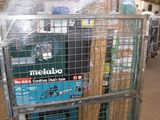 a large metal cart with a lot of items in it