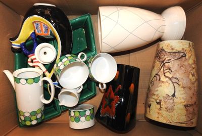a cardboard box with a variety of vases in it