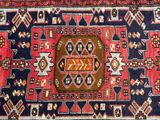 an image of a red and blue area rug with a square design on it