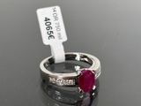 an image of a ruby and diamond ring on a table