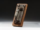 a close up of a metal object on a wooden stand