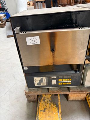 a machine that is sitting on a pallet in a warehouse