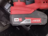 a close up of a corded drill with a battery attached