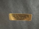 a close up of a label on the back of a black jacket