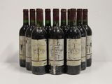 six bottles of wine are lined up in a row