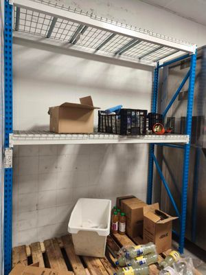 many boxes and boxes on the shelves in the room