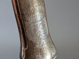 a close up of a person ' s hand holding a metal object