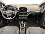 the interior of a car with a steering wheel, dashboard, and dashboard controls