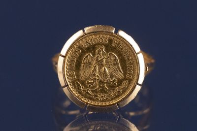 l'image d'un anneau d'or surmonté d'une pièce de monnaie
