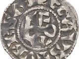 a close up of a silver coin on a white background