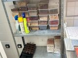 many containers of food sitting on the shelves in the kitchen