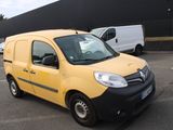 a small yellow van parked in a parking lot