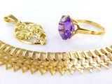 an image of a necklace, ring, and bracelet with a purple stone