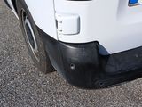a white van parked on the side of the road