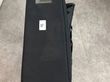 a piece of luggage sitting on the floor next to a chair