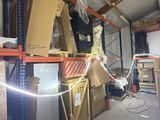 a room with a lot of boxes and boxes on the shelves