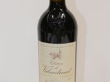 a bottle of wine that is sitting on a table