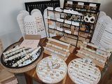 many different types of jewelry displayed on the table