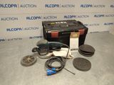 an assortment of tools are sitting on a table in front of a wall