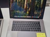 two laptops that are sitting on a table