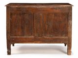 an old wooden chest sitting on top of a white surface