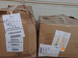 two boxes that are sitting on the ground next to each other