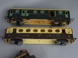 two toy trains sitting next to each other on a table