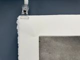 a picture of a bathroom with a toilet and a mirror