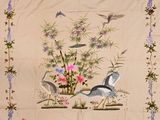 une photo d'un patchwork orné d'oiseaux et de fleurs