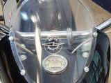 a close up of a motorcycle with a clear cover on it