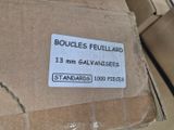 a cardboard box with a label on it that says boucles feuilard