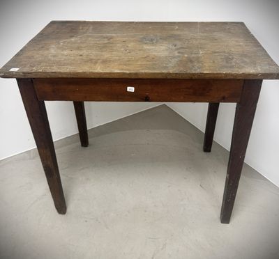 an old wooden table with a small drawer on top of it