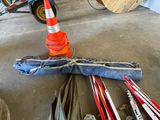 many skis and ski poles laying on the ground