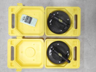 two yellow plastic boxes with a black handle and a yellow lid