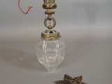 a small glass vase with a star on top of it