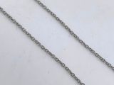 a close up of a chain on a table with a white background