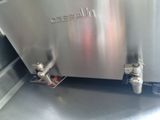 a silver toaster that is sitting on a counter