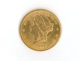 a gold coin with a woman ' s head on it